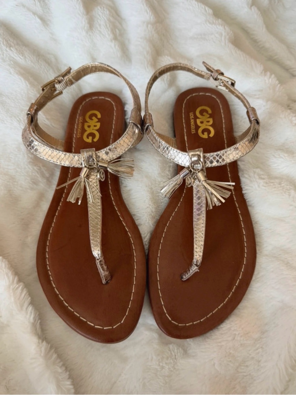 GBG Los Angeles Metallic Gold T-Strap Tassel Sandals